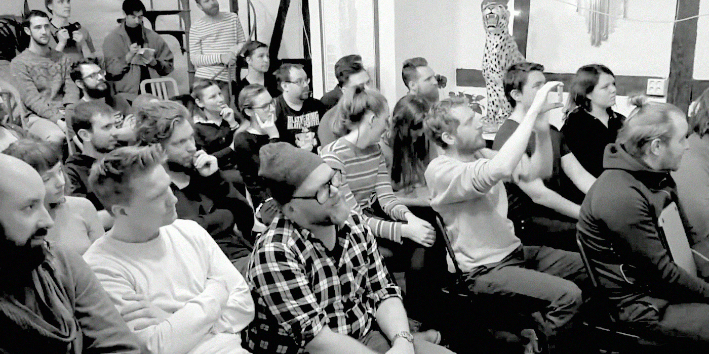 A full room of participants watching the presentations.