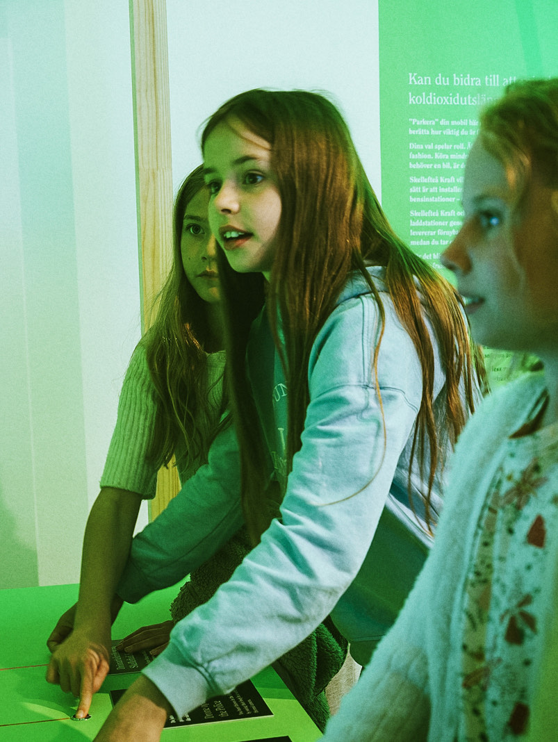 Visitors at an interactive station in the Society Expo exhibition