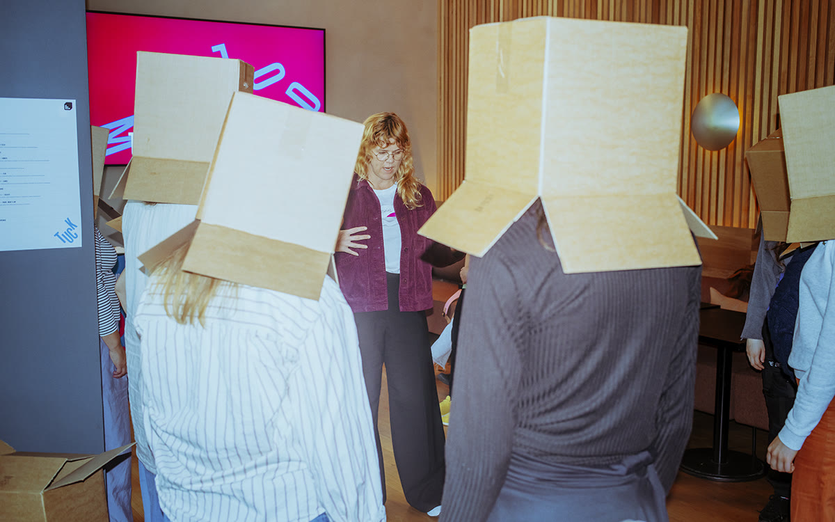 Participants with cardboard boxes on their heads at Unstuck