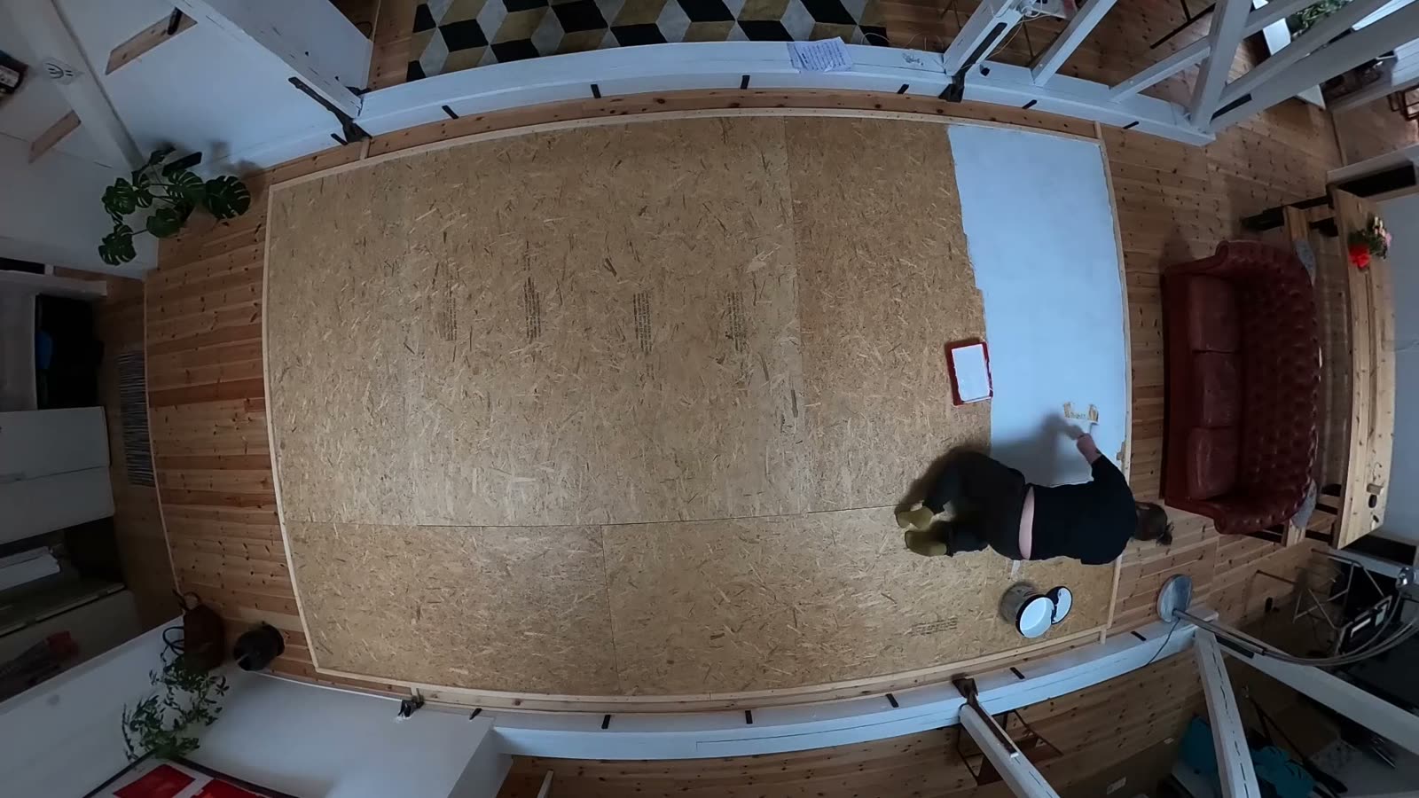 An empty chipboard floor seen from above